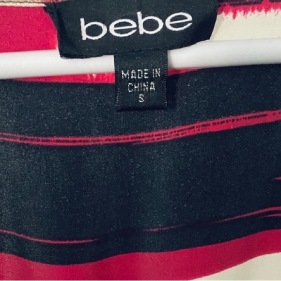 Sexy, classy, BeBe bodycon dress with ruffle cap sleeves & ruffle bottom. - Picture 3 of 5